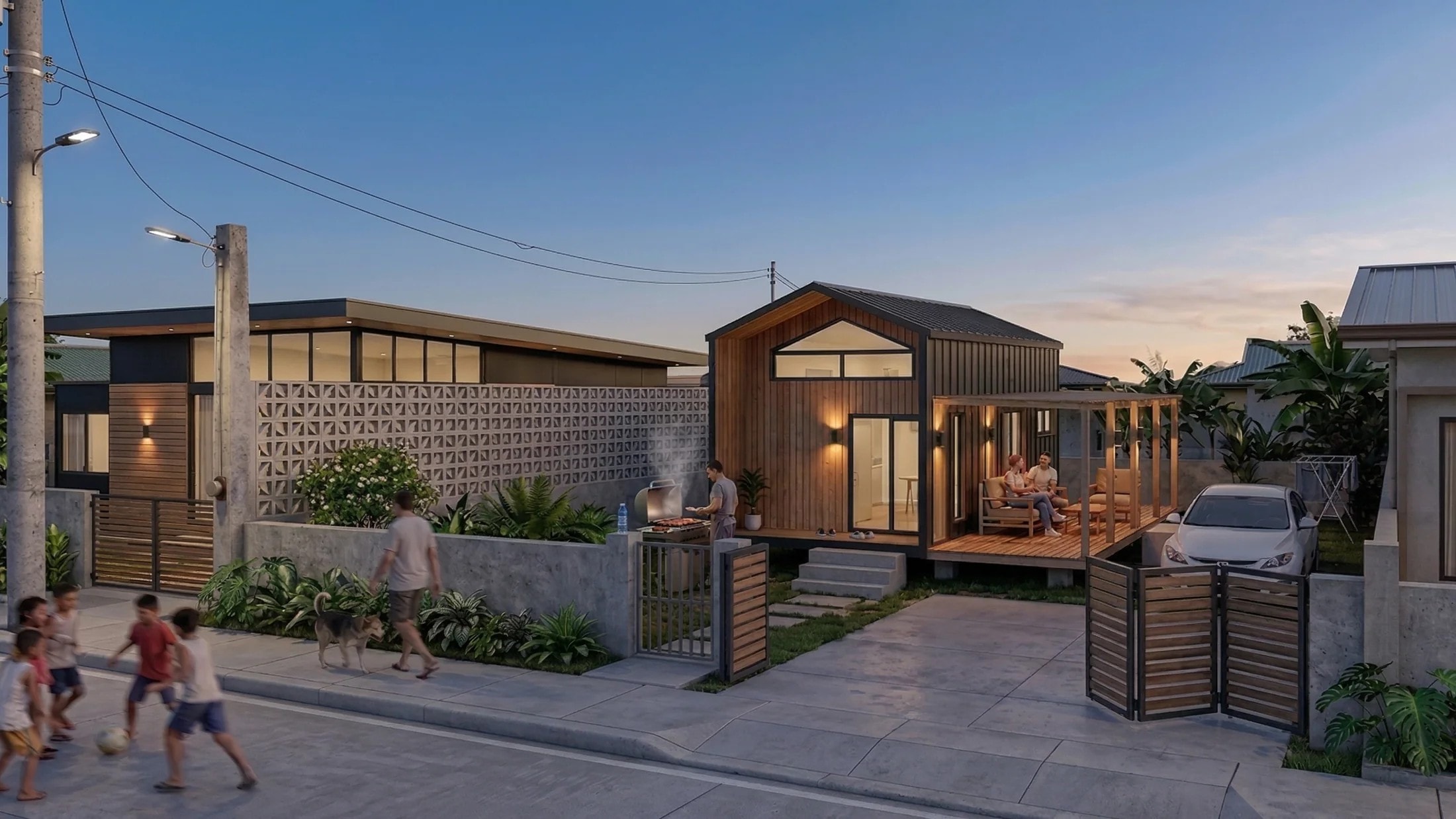 Cubo's Sarangani Signature tiny house exterior at evening, with a family relaxing on the deck