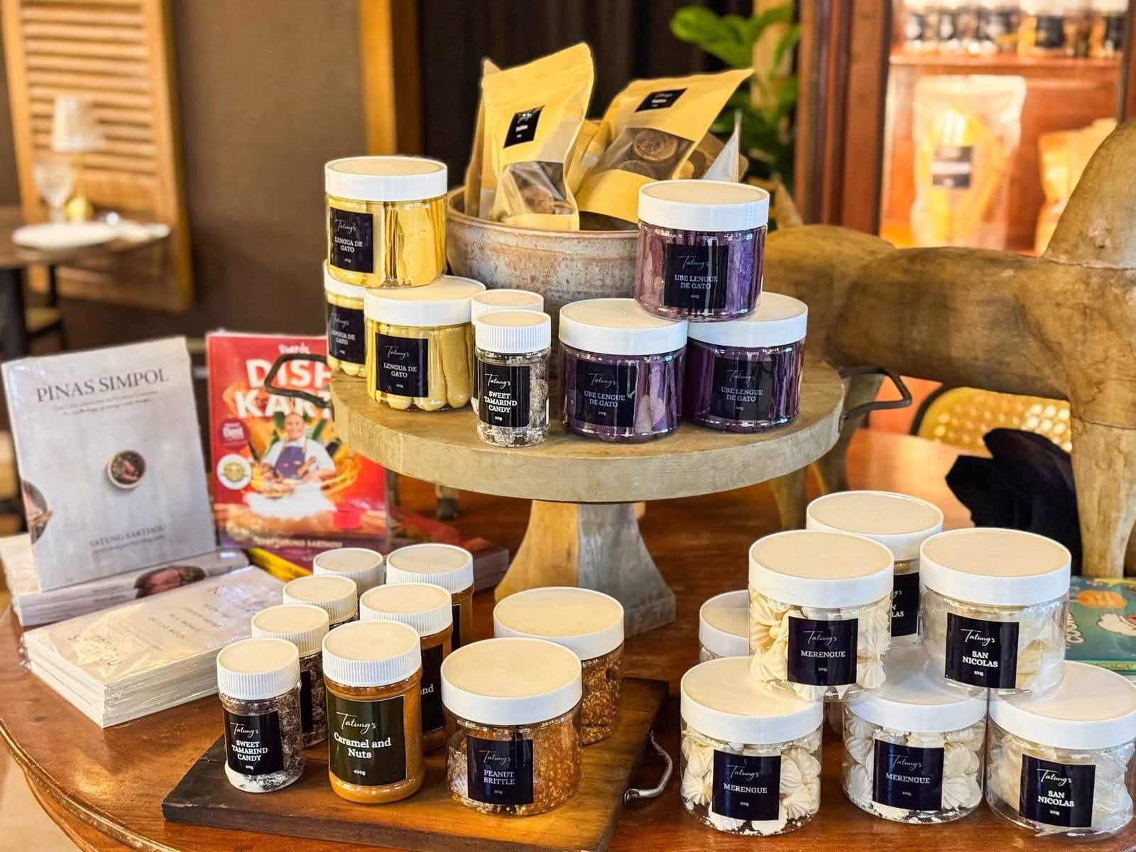 Display of Tatung's Simpol pantry products including Lengua de Gato and San Nicolas cookies