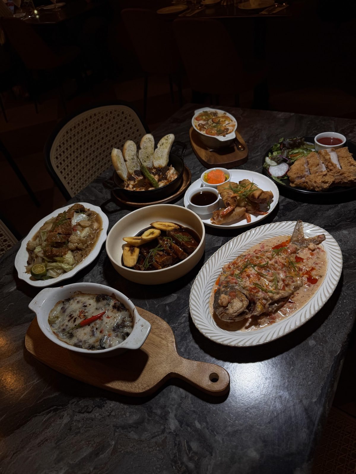 Full table spread at Tatung's showing multiple Filipino heirloom dishes